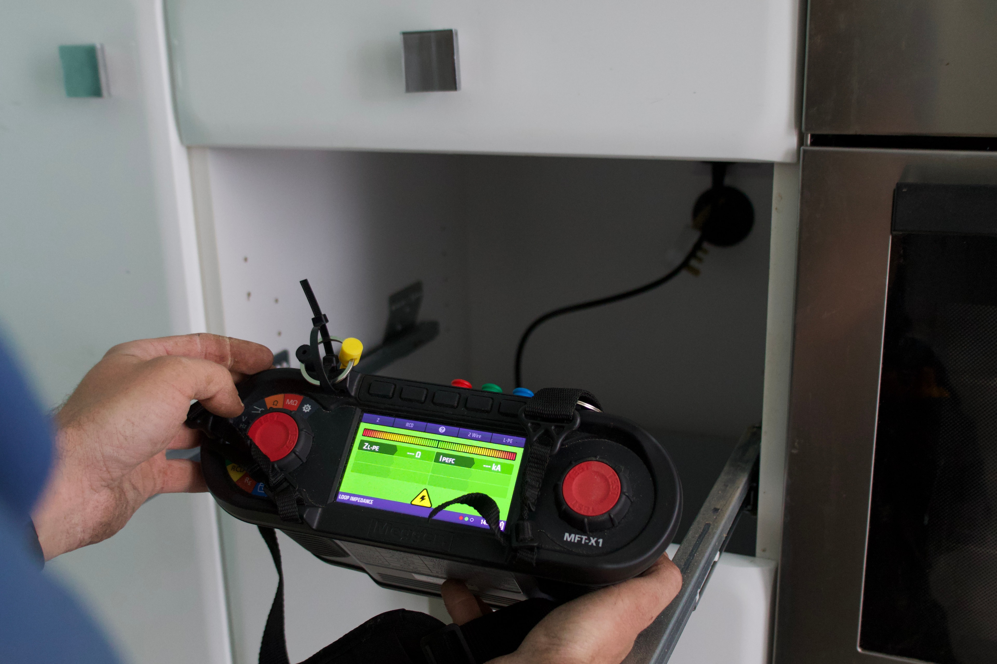 Electrician diagnosing an electrical fault